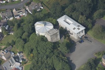 Oblique aerial view of Mearns Castle, looking N.