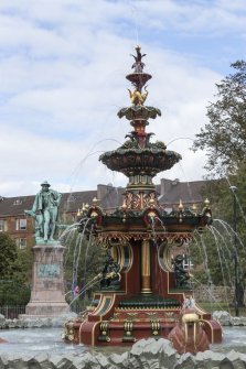 Fountain and statue behind.