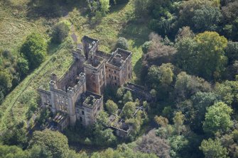 Oblique aerial view of Lennox Castle, looking SE.