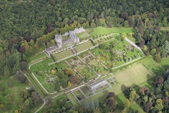 Oblique aerial view of Drummond Castle and formal garden, looking NNW.