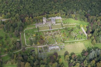 Oblique aerial view of Drummond Castle and formal garden, looking NNW.