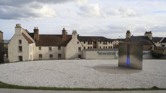 Rear elevation, view from north with sculpture in foreground.