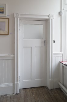 Interior. Detail of door within office to north of entrance hall