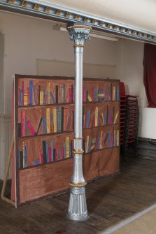 Interior. View of balcony front and supporting column within main hall