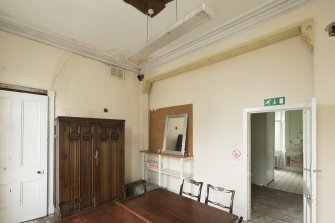 Interior.  View of 1st floor meeting room, formed by later partitioning of larger space, taken from north east