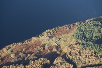 Oblique aerial view of Portmark farmstead and S end of tracked target range, looking NW.