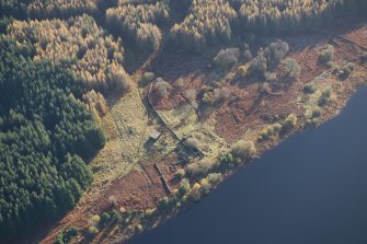 Oblique aerial view of Portmark farmstead and S end of tracked target range, looking SE.