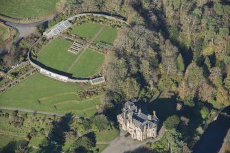 Oblique aerial view of Knockdolian Castle Country House, looking N.