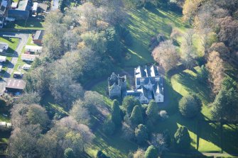Oblique aerial view of Kirkhill House and Kirkhill Castle, looking SW.