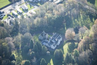 Oblique aerial view of Kirkhill House and Kirkhill Castle, looking W.
