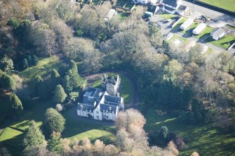 Oblique aerial view of Kirkhill House and Kirkhill Castle, looking SE.