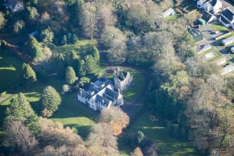 Oblique aerial view of Kirkhill House and Kirkhill Castle, looking ESE.