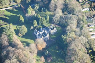 Oblique aerial view of Kirkhill House and Kirkhill Castle, looking E.