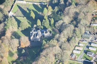 Oblique aerial view of Kirkhill House and Kirkhill Castle, looking NE.