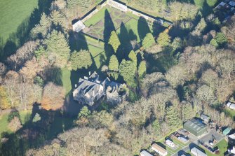 Oblique aerial view of Kirkhill House and Kirkhill Castle, looking N.