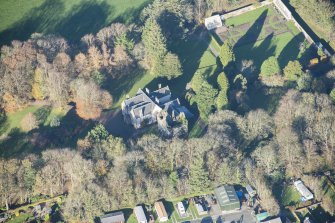Oblique aerial view of Kirkhill House and Kirkhill Castle, looking NW.