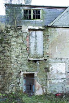 Exterior. Detail of windows and doorway on north elevation.