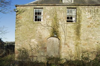 Exterior. Detail of windows and doorway on south elevation.