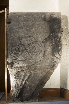 View of Pictish symbol stone. Peripheral lighting. (with scale)
