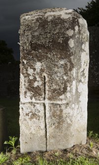 View of pillar with incised cross. Peripheral lighting.