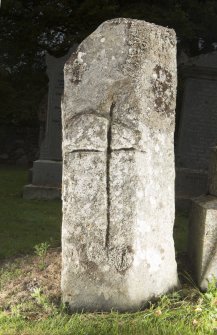 View of pillar with incised cross. Peripheral light.