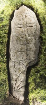 View of recumbent cross slab. Peripheral lighting.