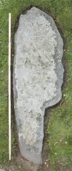 View of recumbent cross slab. Available light. (with scale.)