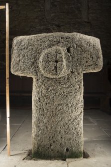 View of cruciform stone situated inside church. Peripheral lighting. (with scale.)