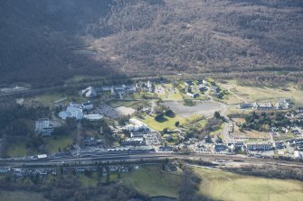 General oblique aerial view of Aviemore showing the Railway Station, Four Seasons Hotel and leisure centre, looking W.