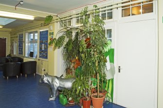 Interior. General view of entrance hall showing small janitor's room.