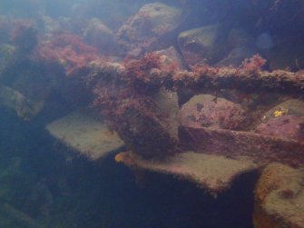 View of steel piping and rock ballast on steamship Numidian