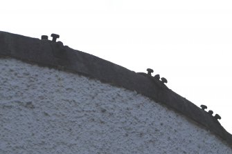 Detail of metal pins on coping on top of boundary wall of Whitefoord House complex, adjacent to 142 and 144 Calton Road, Edinburgh.