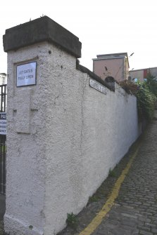 View from north of boundary wall to Campbell's Close to west of Whitefoord House and Callendar House, Canongate, Edinburgh.