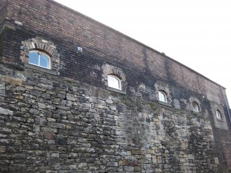 View of part of boundary wall to Gasworks, New Street, Edinburgh, off Old Tolbooth Wynd.