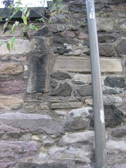 Detail of western boundary wall of Canongate Churchyard, Canongate, Edinburgh, in Old Tolbooth Wynd, showing alterations to stonework, possibly for new monuments being installed within Churchyard.