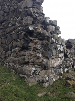 Knockdavie Castle. Detail of the north west corner, where the dressed quions have been robbed.