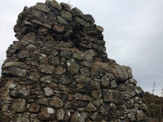 Knockdavie Castle. Detail of second floor scarcement and blocked opening in western part of northern wall.