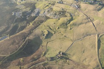 Oblique aerial view of the mining remains, looking W.