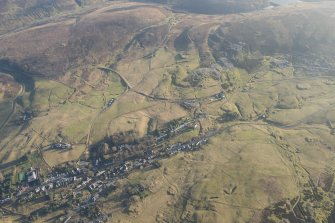 General oblique aerial view of Leadhills village, the mining remains and the golf course, looking E.