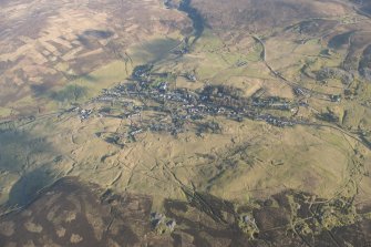 General oblique aerial view of Leadhills village, the mining remains and the golf course, looking E.