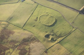 Oblique aerial view of the settlement and quarry, looking SW.