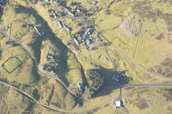 Oblique aerial view of Wanlockhead and mining remains, looking WNW.