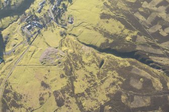 Oblique aerial view of Wanlockhead and mining remains, looking WSW.