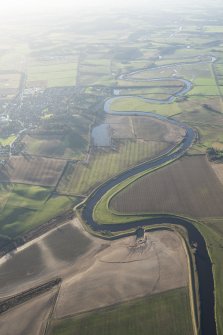 General oblique aerial view along the River Isla with the flood damage in the foreground and Coupar Angus in the middle distance, looking SW.