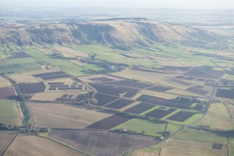 General oblique aerial view of the site of the Scottish Ploughing Championships held on Newlands and Pittendreich Farms 25 and 26 October 2014 with the Lomond Hills beyond, looking SE.