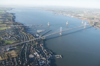 General oblique aerial view of the Forth Road Bridge and the construction of the Queensferry Crossing, looking NW.
