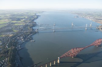 General oblique aerial view of the Forth Bridge, the Forth Road Bridge and the construction of the Queensferry Crossing, looking WNW.