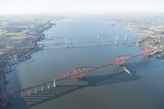 General oblique aerial view of the Forth Bridge, the Forth Road Bridge and the construction of the Queensferry Crossing, looking WNW.