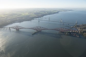 General oblique aerial view of the Forth Bridge, the Forth Road Bridge and the construction of the Queensferry Crossing, looking WSW.