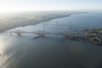 General oblique aerial view of the Forth Bridge, the Forth Road Bridge and the construction of the Queensferry Crossing, looking WSW.